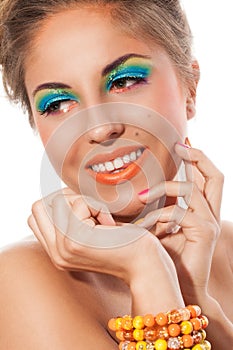 Beautiful girl with handmade bracelet and artistic makeup