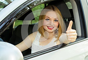 Beautiful girl is happy with purchase car
