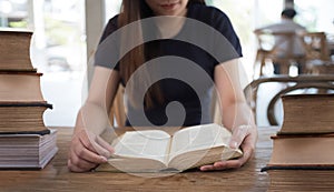 beautiful girl happy to sit reading a book Close-up of female re