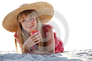 Beautiful girl in hat at beach