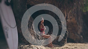 Beautiful girl having sunbath on beach.
