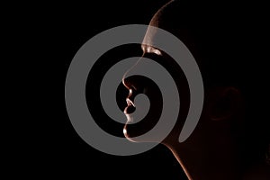 Beautiful girl head slightly lit