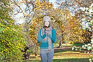 Beautiful girl hold an apple on sunny autumn-day