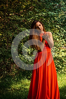 Beautiful girl holding apple in the park