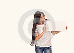 Beautiful girl holding a blank billboard