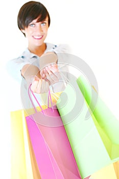 Beautiful girl holding colorful shopping bags