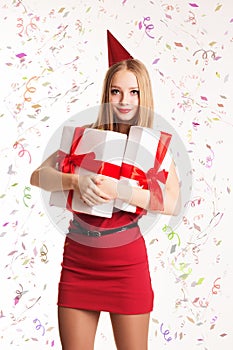 Beautiful girl holding gift boxes, happy Birthday