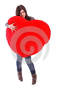 Beautiful girl holding red heart