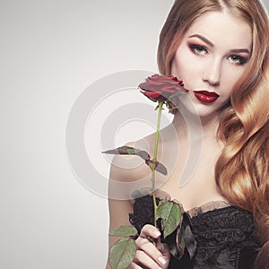 Beautiful girl holding a rose