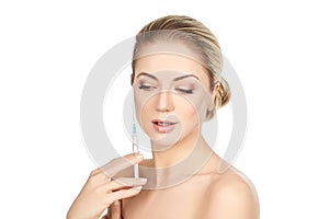 Beautiful girl holding syringe isolated on white