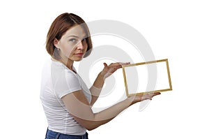 Beautiful girl holds a light wooden frame