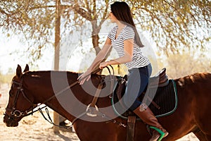 Beautiful girl horseback riding