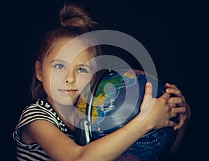 Beautiful girl hugging a globe