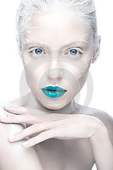 Beautiful girl in the image of albino with blue lips and white eyes. Art beauty face.