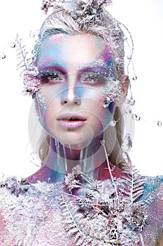 Beautiful girl in the image of a snowy unicorn creature. Creative make up. Art look.