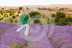 Beautiful girl on lavender field