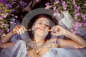 A beautiful girl in a lavender field. Beauty, beautiful makeup