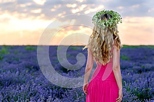 Beautiful Girl in lavender Field at sunset