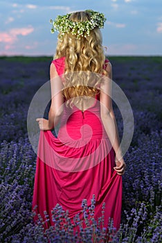 Beautiful Girl in a lavender Field at sunset