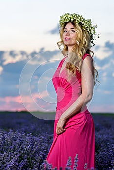 Beautiful Girl in a lavender Field at sunset