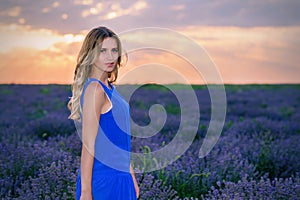 Beautiful Girl in lavender Field at sunset