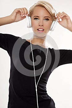 Beautiful girl is listen to the music