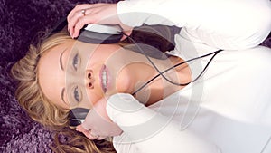 Beautiful girl listening to music headphones