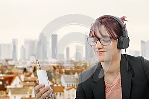 Beautiful girl listening to music with headphones