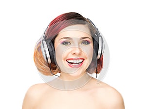 Beautiful girl listening to the music throughout headphones