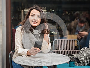 Beautiful girl listens music with headphones