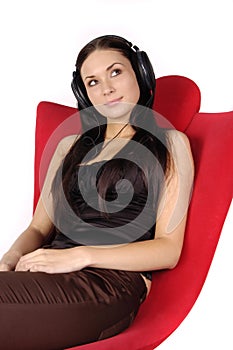 Beautiful girl listens to music in headphones