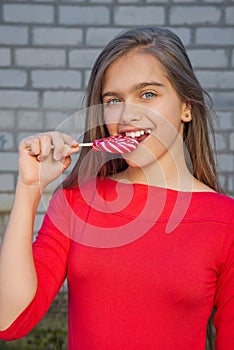 Beautiful girl with lollipop.