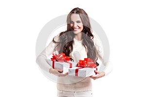 Beautiful girl with long hair holding two gift boxes.