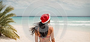Beautiful Girl long hair posing Santa hat vacation sea advertising vacation concept