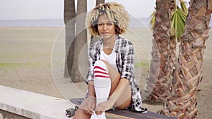 beautiful girl with longboard on the beach