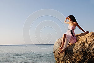 Beautiful girl looking far away photo