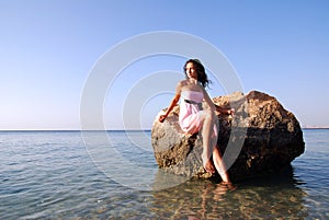 Beautiful girl looking far away