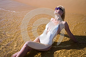 Beautiful girl lying beach