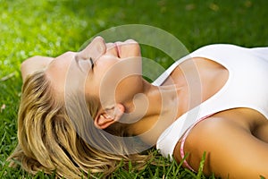 Beautiful Girl lying on the grass