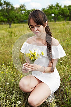 Beautiful girl in a meadow