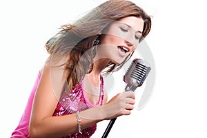 Beautiful girl with a microphone singing a song