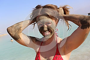 Beautiful girl with mud mask