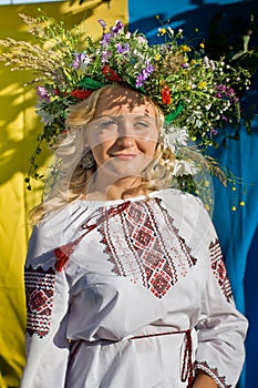 Beautiful girl in national Ukrainian embroidery shirt and wreat