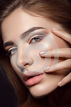 Beautiful girl with natural make-up and manicure