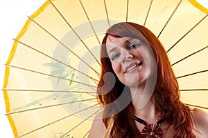 Beautiful girl with parasol smiling.