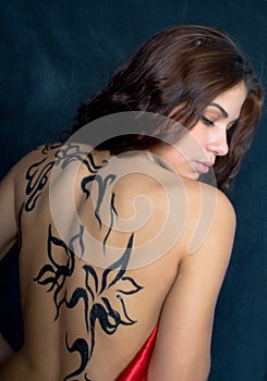 A beautiful girl with a pattern on its back