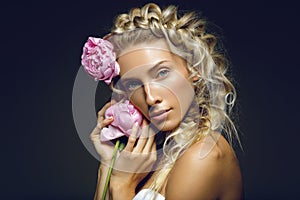 Beautiful girl with peony flower