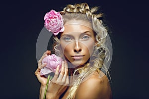 Beautiful girl with peony flower