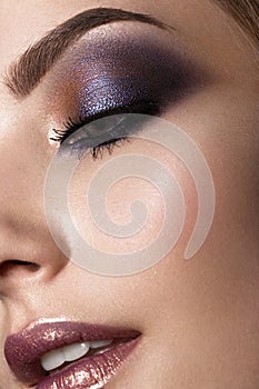 Beautiful girl with perfect skin, colorful make-up. .Beauty face. Close up