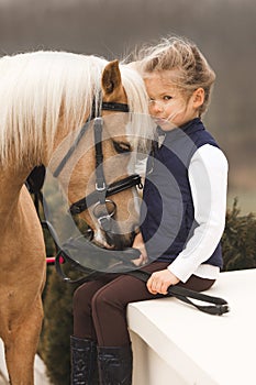 Beautiful Girl pet horse in farm. park on background